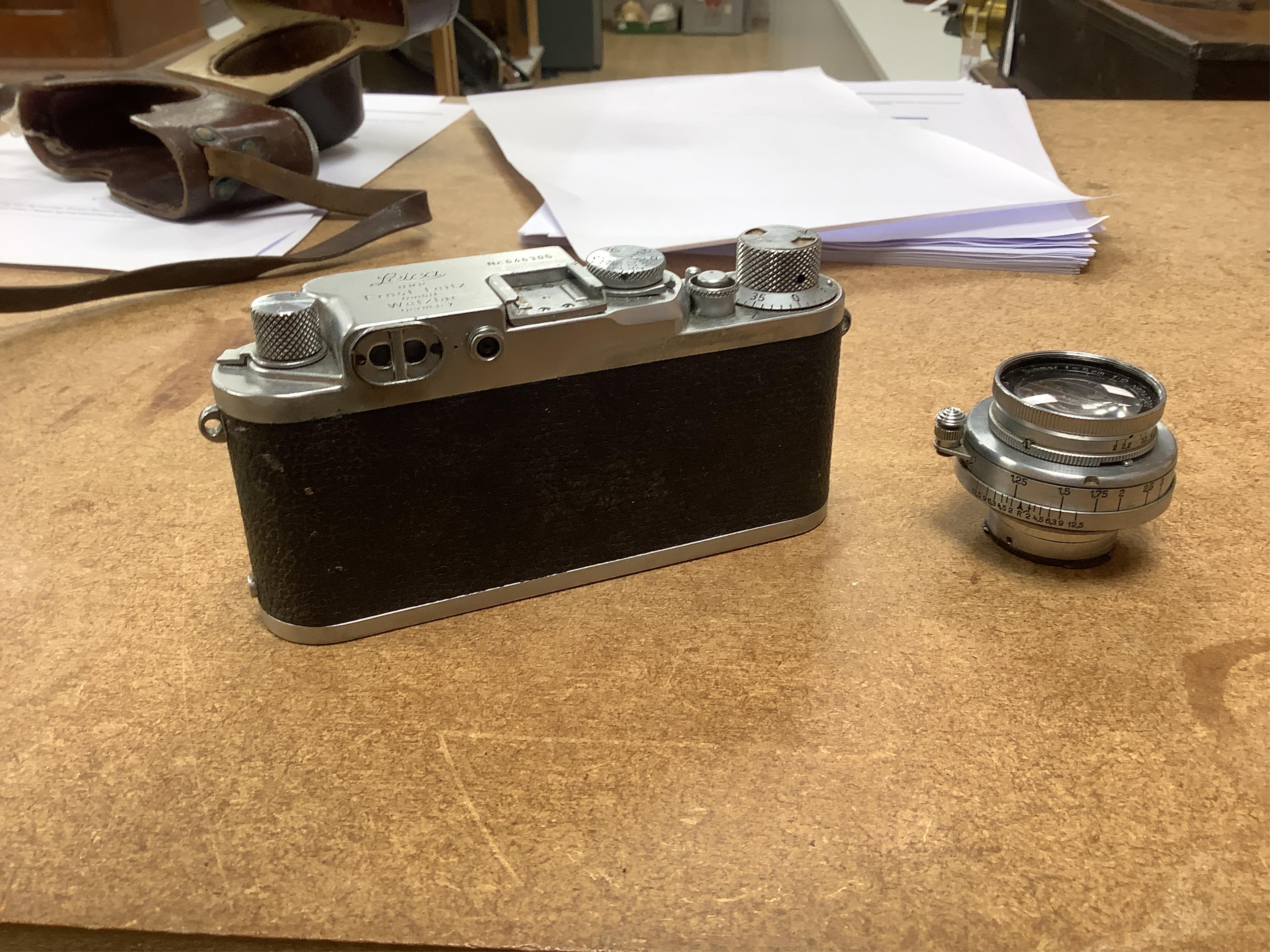 A Leica IIIf camera, Nr.646305, with summar f=5cm 1:2 lens, with leather case with strap